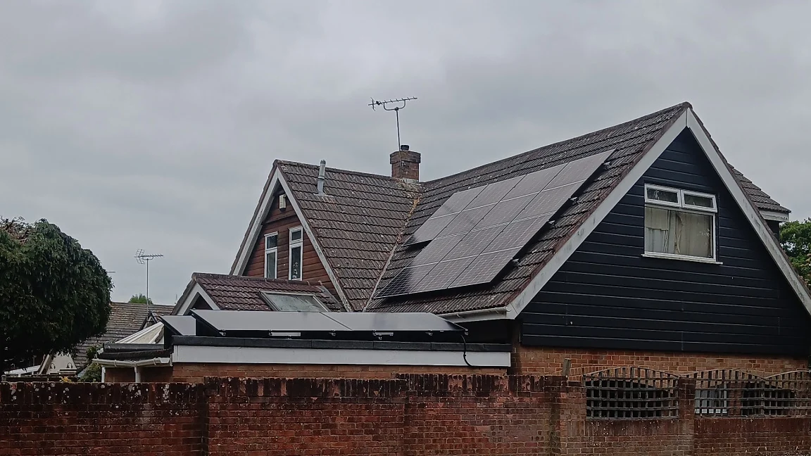 Solar panels installed across the available roof faces of a chalet-style property in Cowplain, Waterlooville