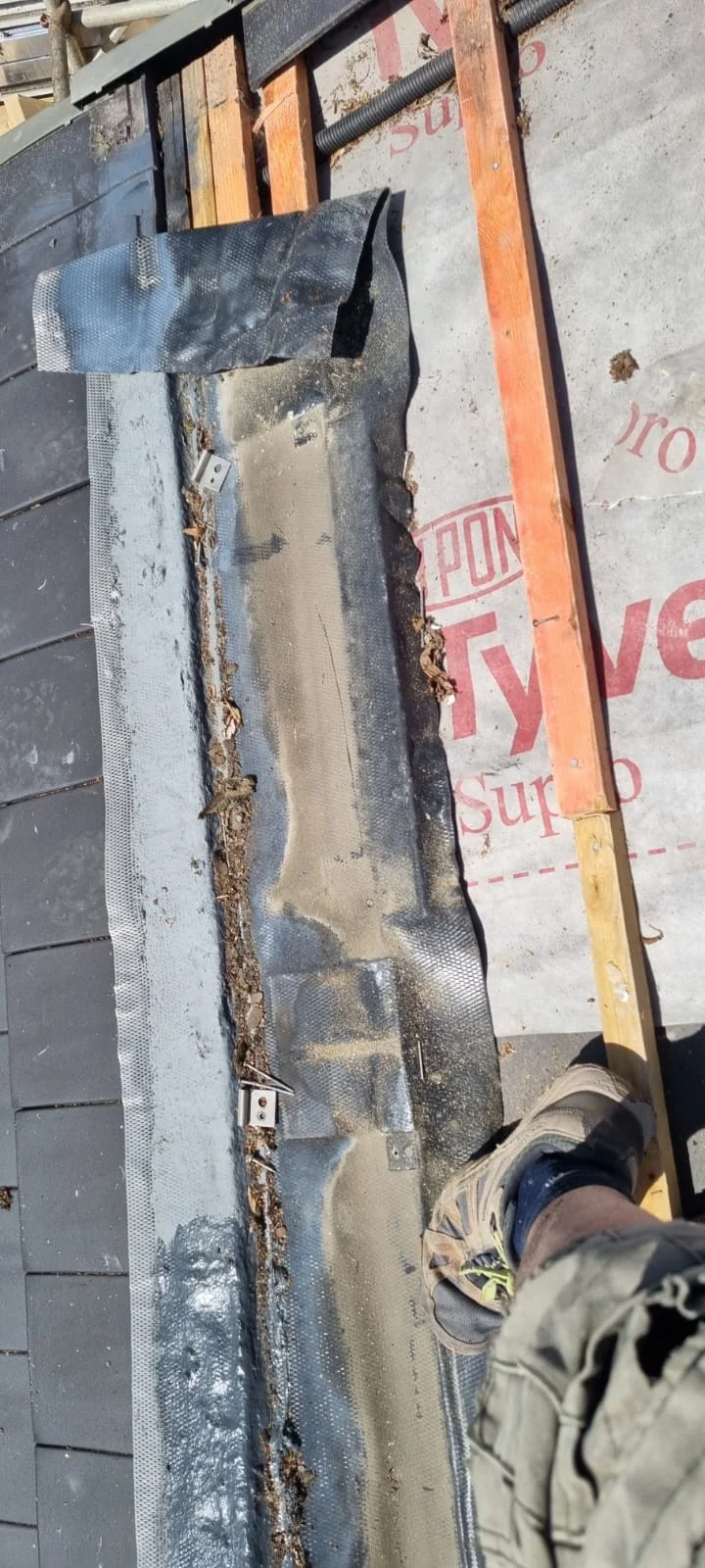 Incorrectly installed flashing detail around an in-roof solar PV system