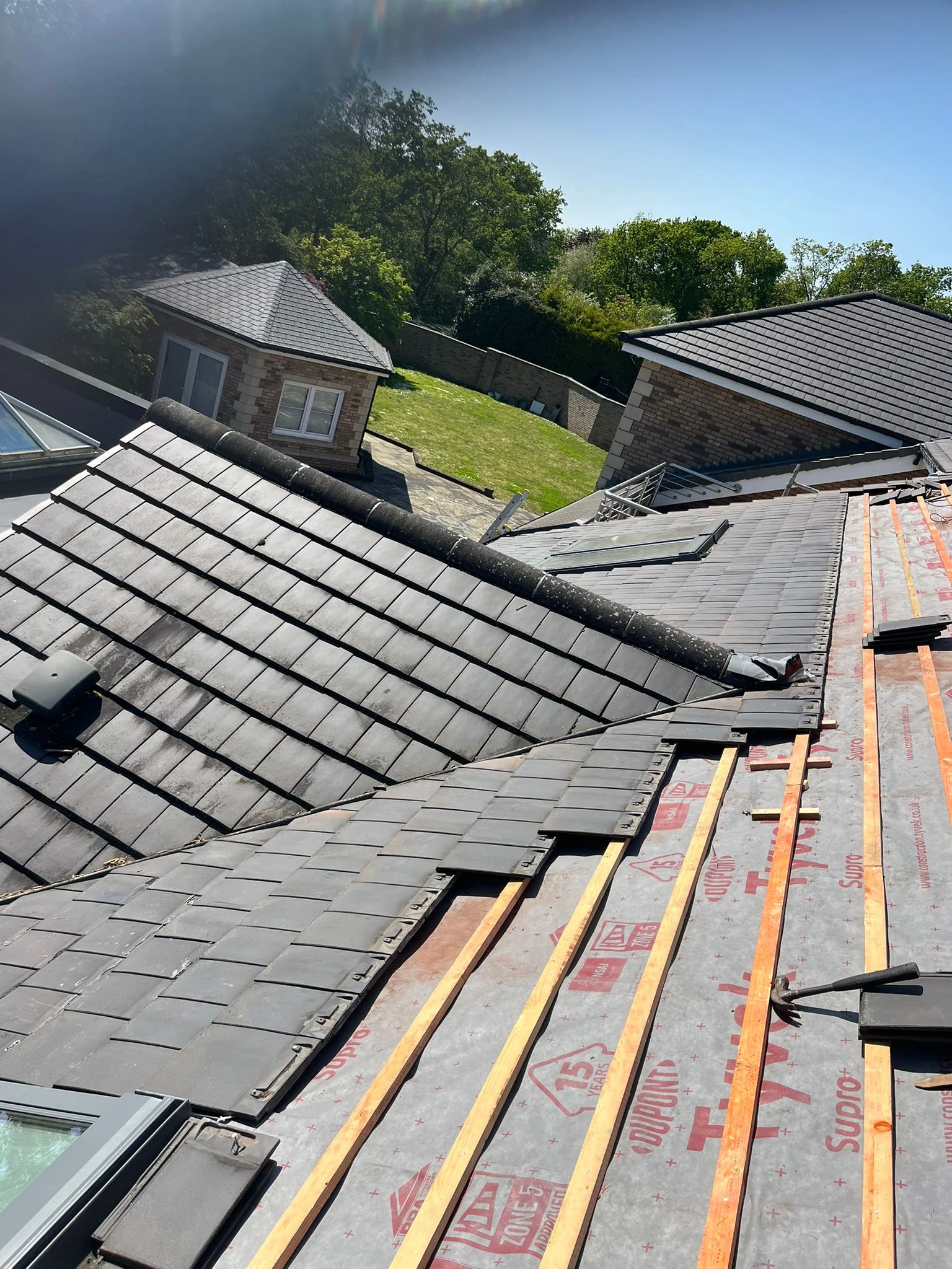 Roof tiles being replaced after solar PV removal and roof repair works