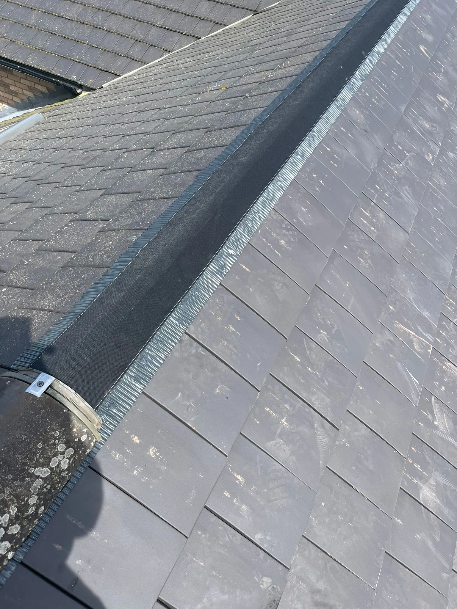 New dry ridge kit being installed during roof repair works