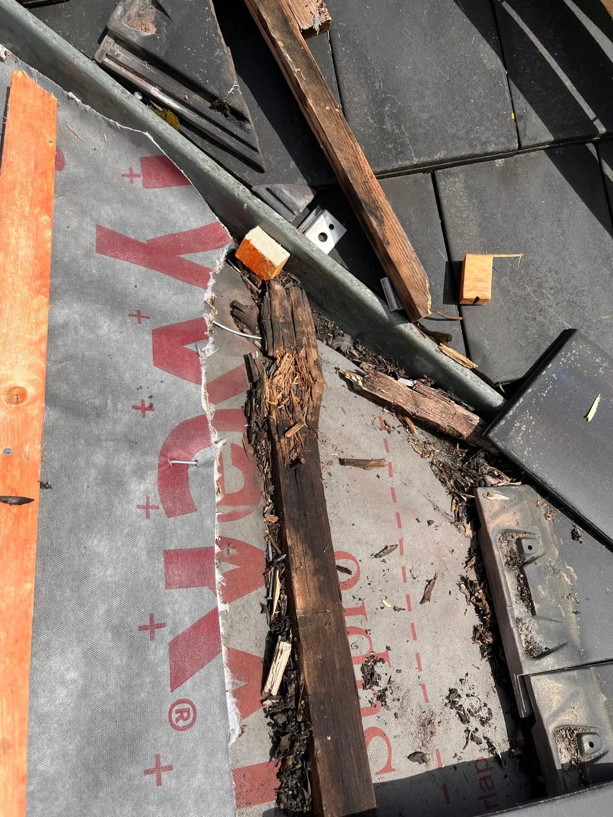 Rotted roof battens exposed during solar PV roof repair works